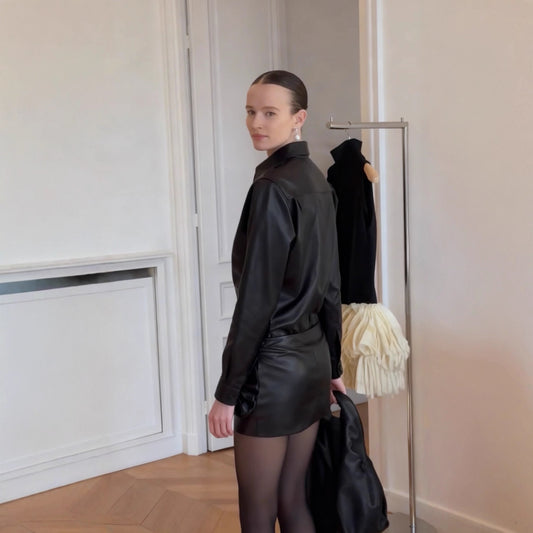 Two piece set of slim fit leather jacket and half skirt